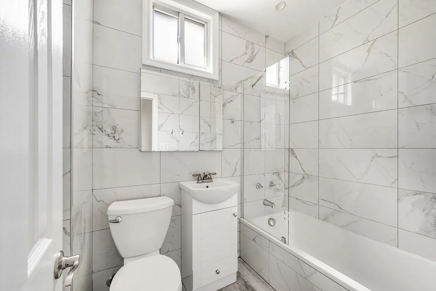 a bathroom with a toilet sink and bathtub