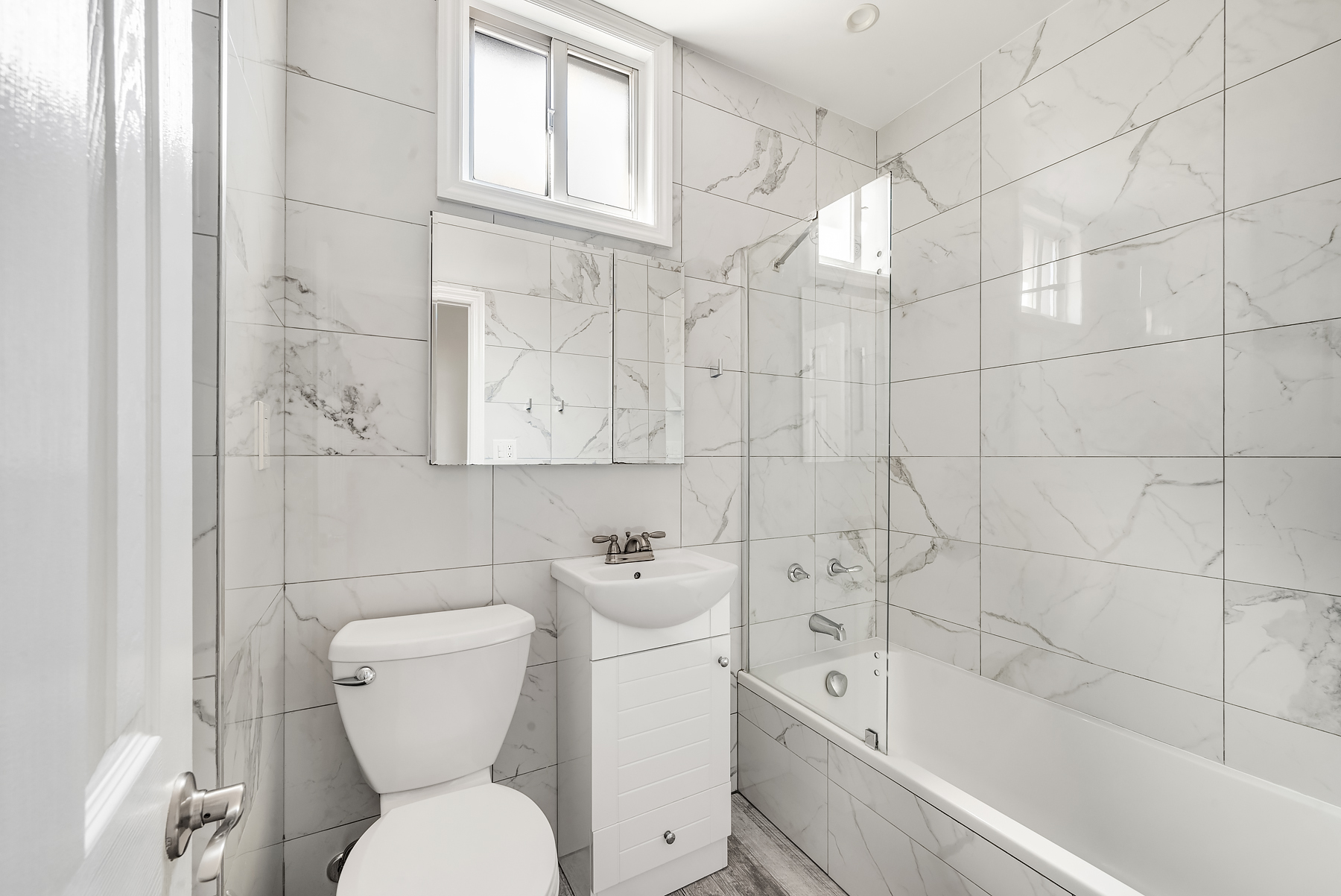 115 Jewel Street, Unit 2L Brooklyn, NY 11222 - Photo 5 of 6 a bathroom with a toilet sink and bathtub