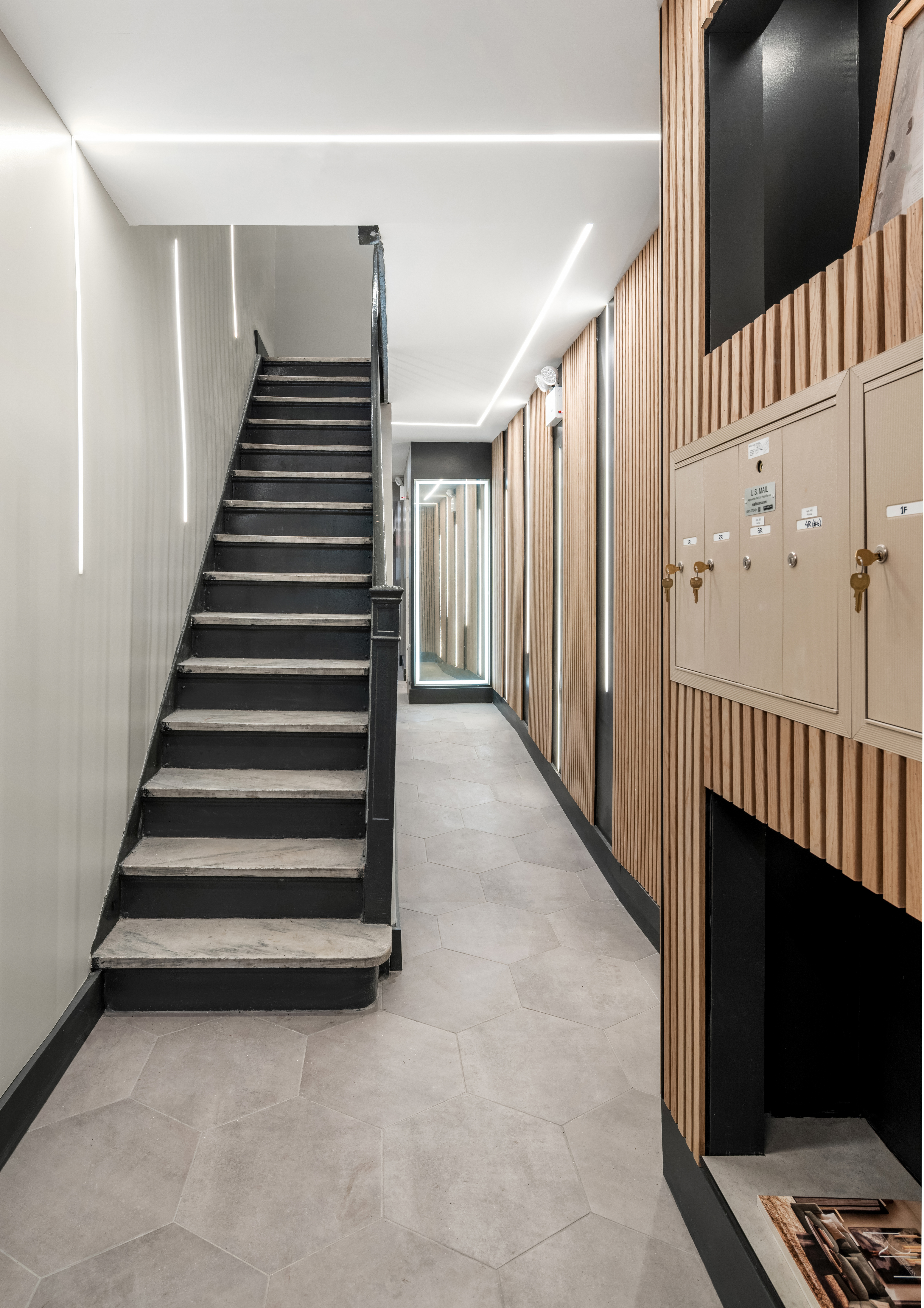 227 East 21st Street, Unit 2R Manhattan, NY 10010 - Photo 11 of 12 a view of a hallway with staircase