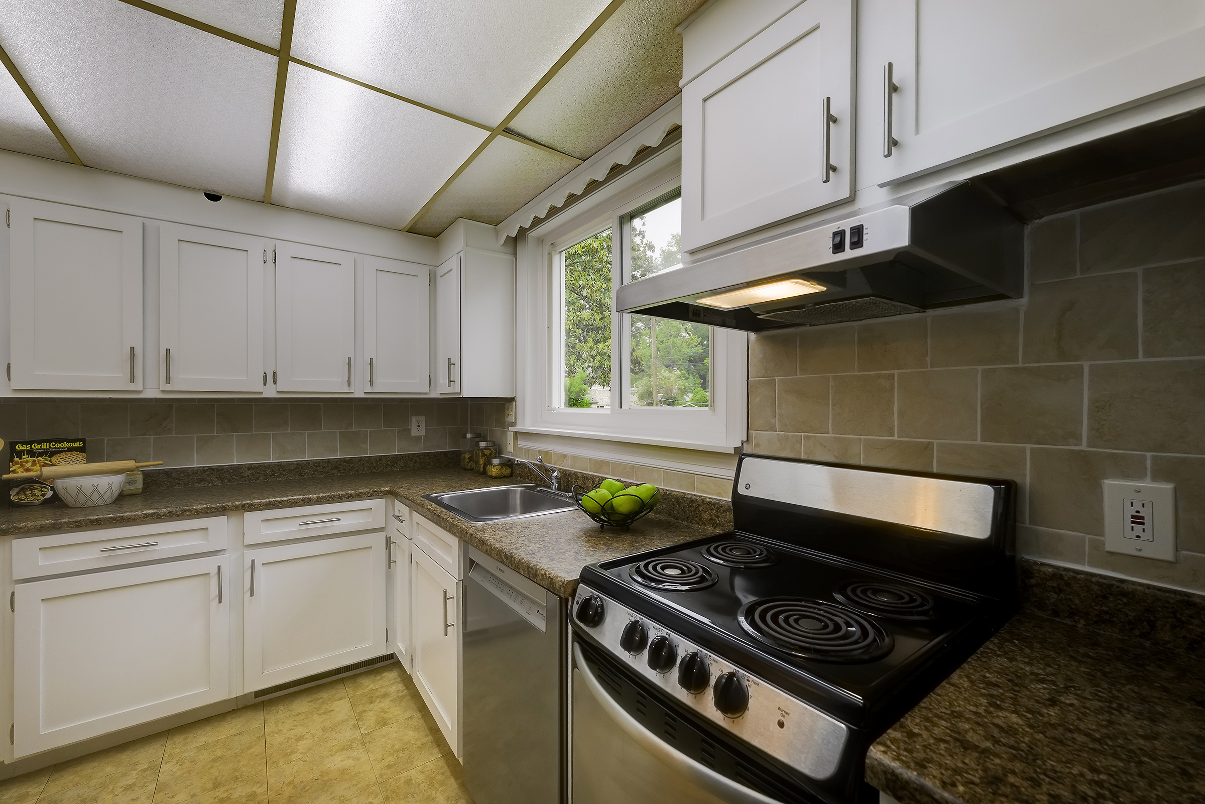 45 D Ridge Road Greenbelt, MD 20770 - Photo 12 of 35 a kitchen with a stove a sink and cabinets