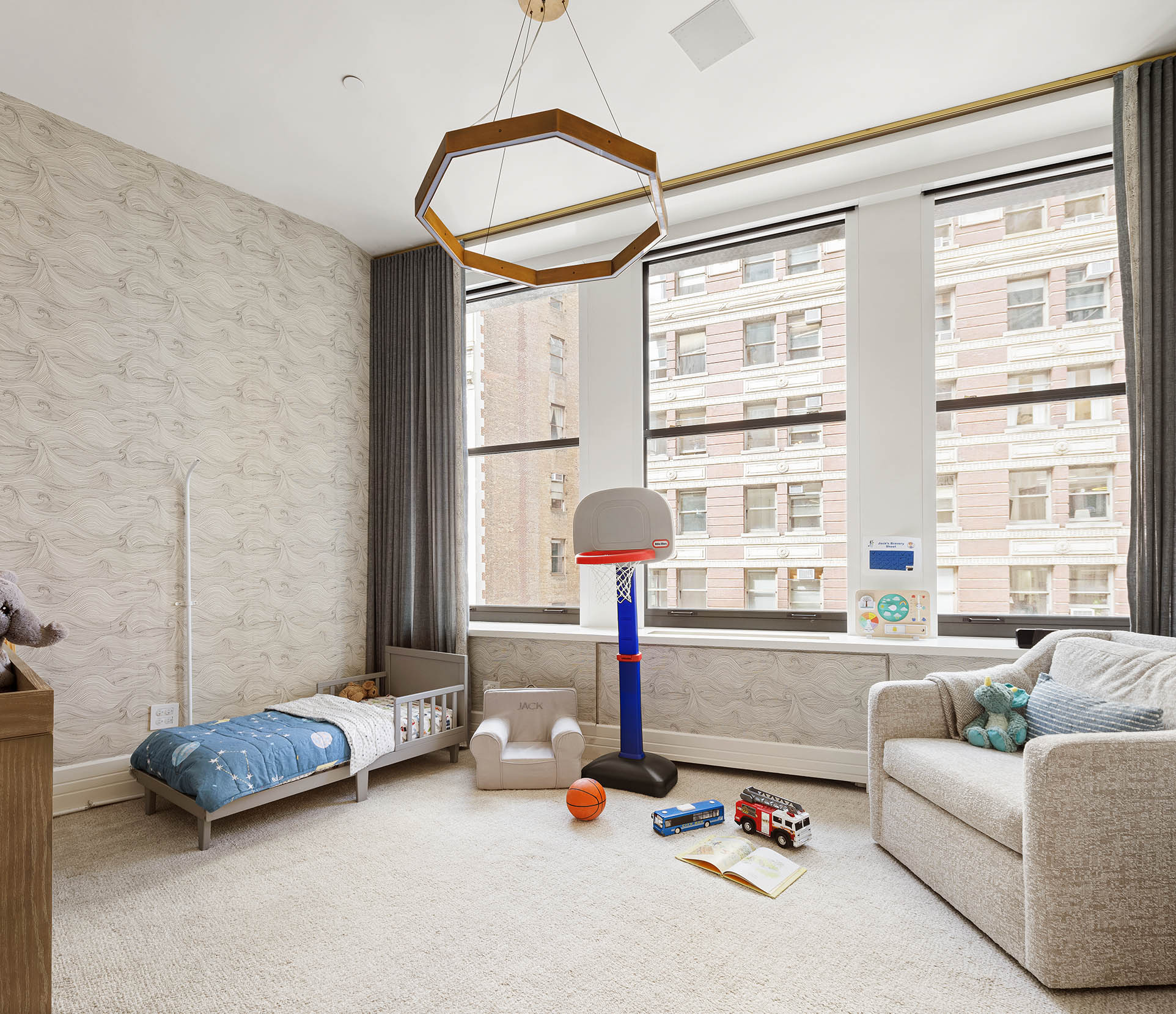 212 5th Avenue, Unit 9B Manhattan, NY 10010 - Photo 10 of 16 a bedroom with furniture and a large window