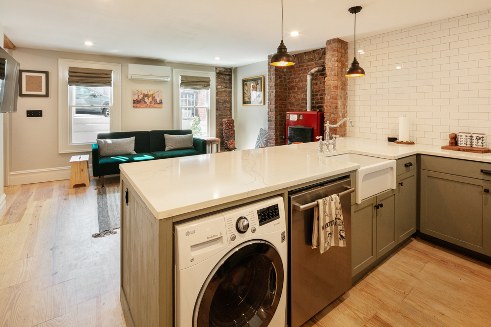 333 Prospect Avenue, Unit G Brooklyn, NY 11215 - Photo 3 of 8 a view of a kitchen with a sink a window and wooden floor