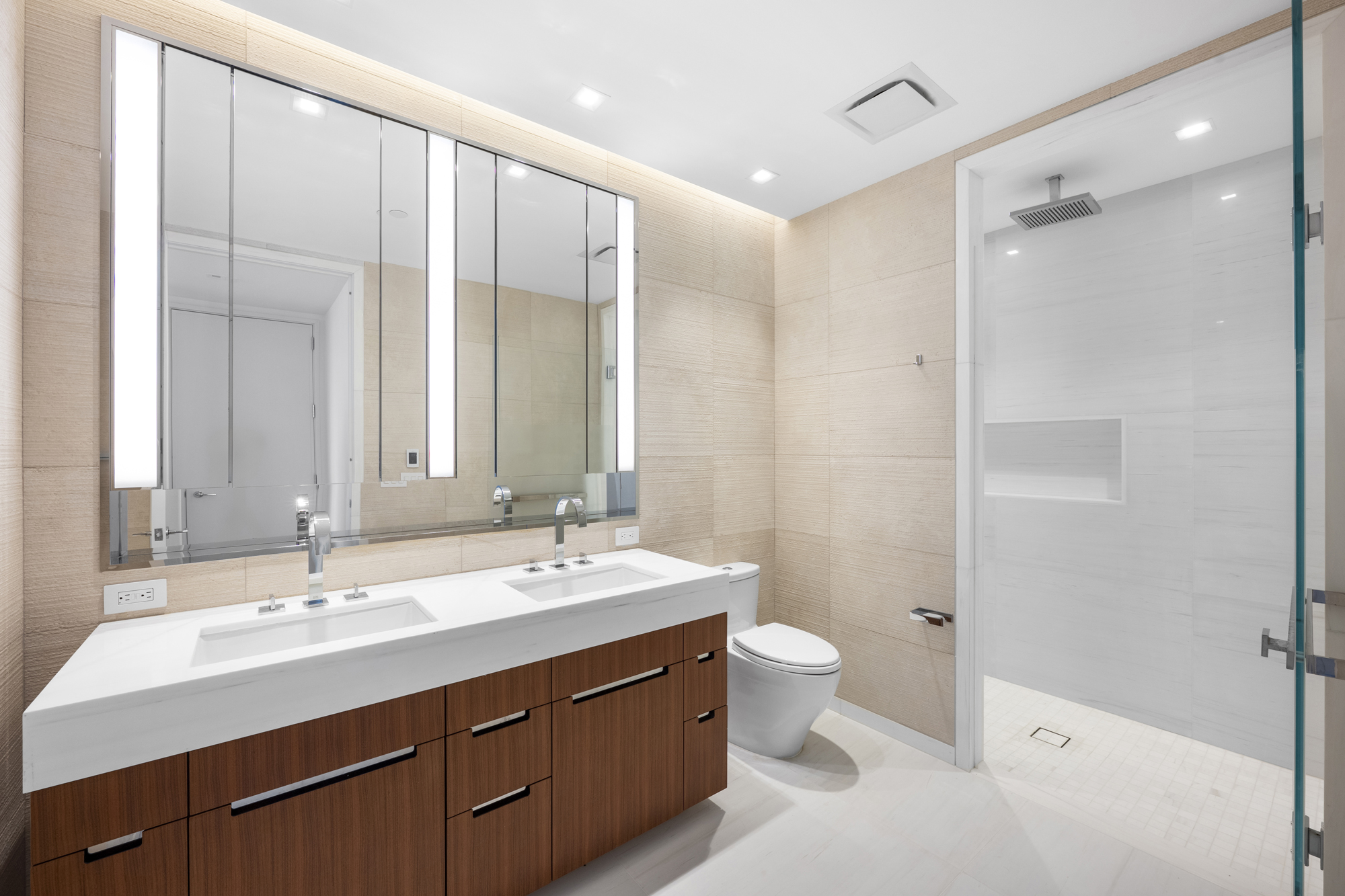1 West End Avenue, Unit 26G Manhattan, NY 10023 - Photo 16 of 33 a bathroom with a double vanity sink mirror and toilet