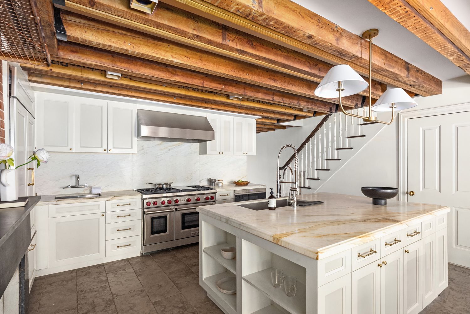 a kitchen with stainless steel appliances granite countertop a sink and cabinets