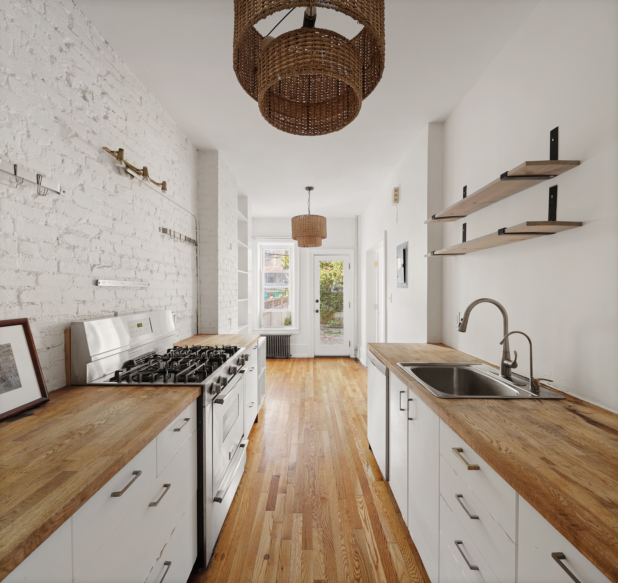 195 Lefferts Avenue Brooklyn, NY 11225 - Photo 6 of 18 a kitchen with stainless steel appliances granite countertop a sink stove and cabinets