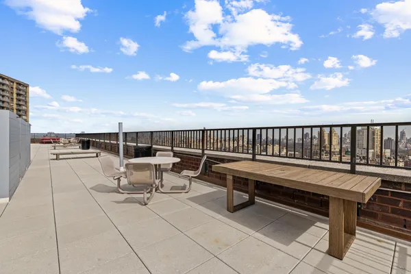 a view of terrace with seating area and barbeque oven
