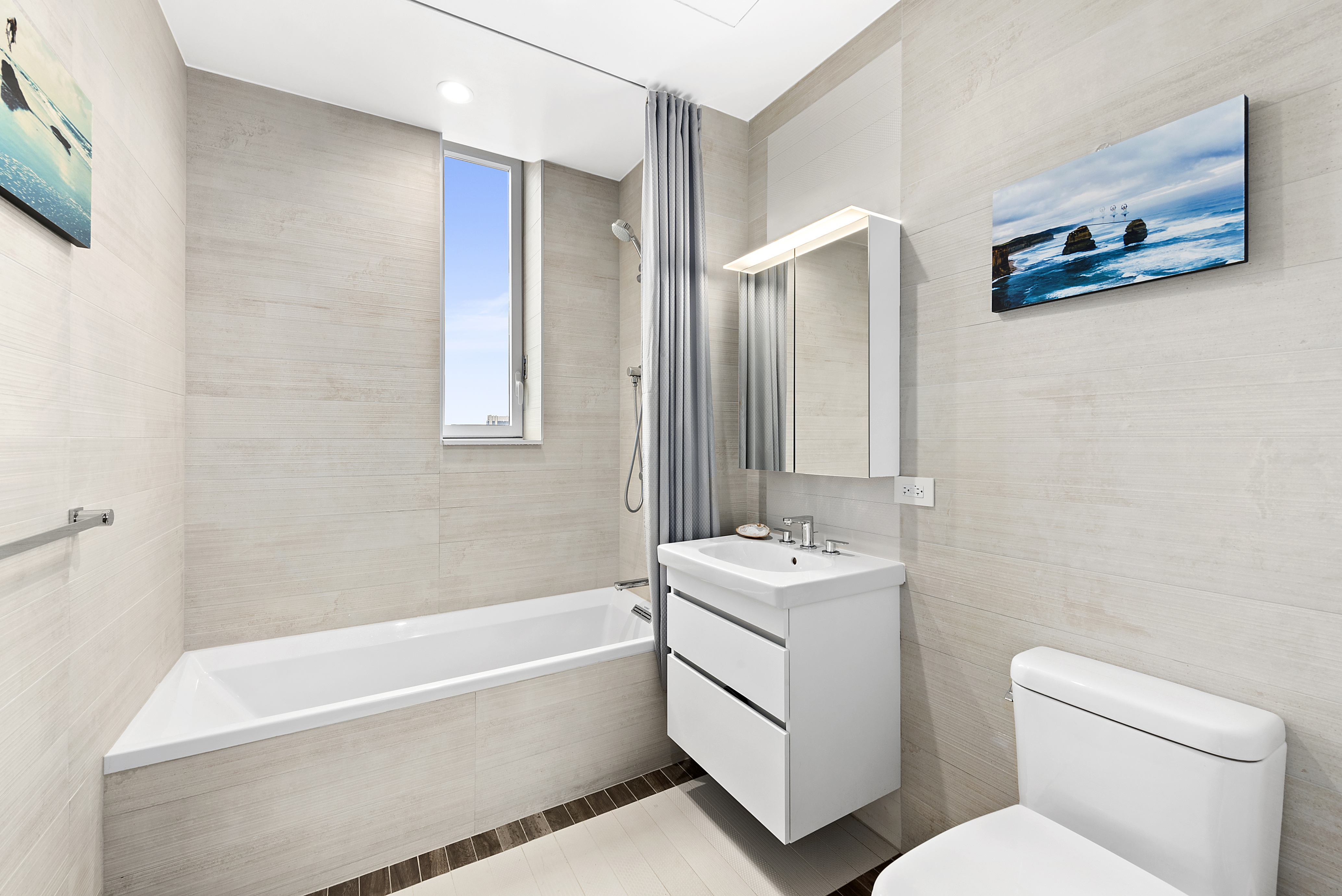 285 West 110th Street, Unit 9B Manhattan, NY 10026 - Photo 9 of 20 a bathroom with a toilet a sink and bathtub