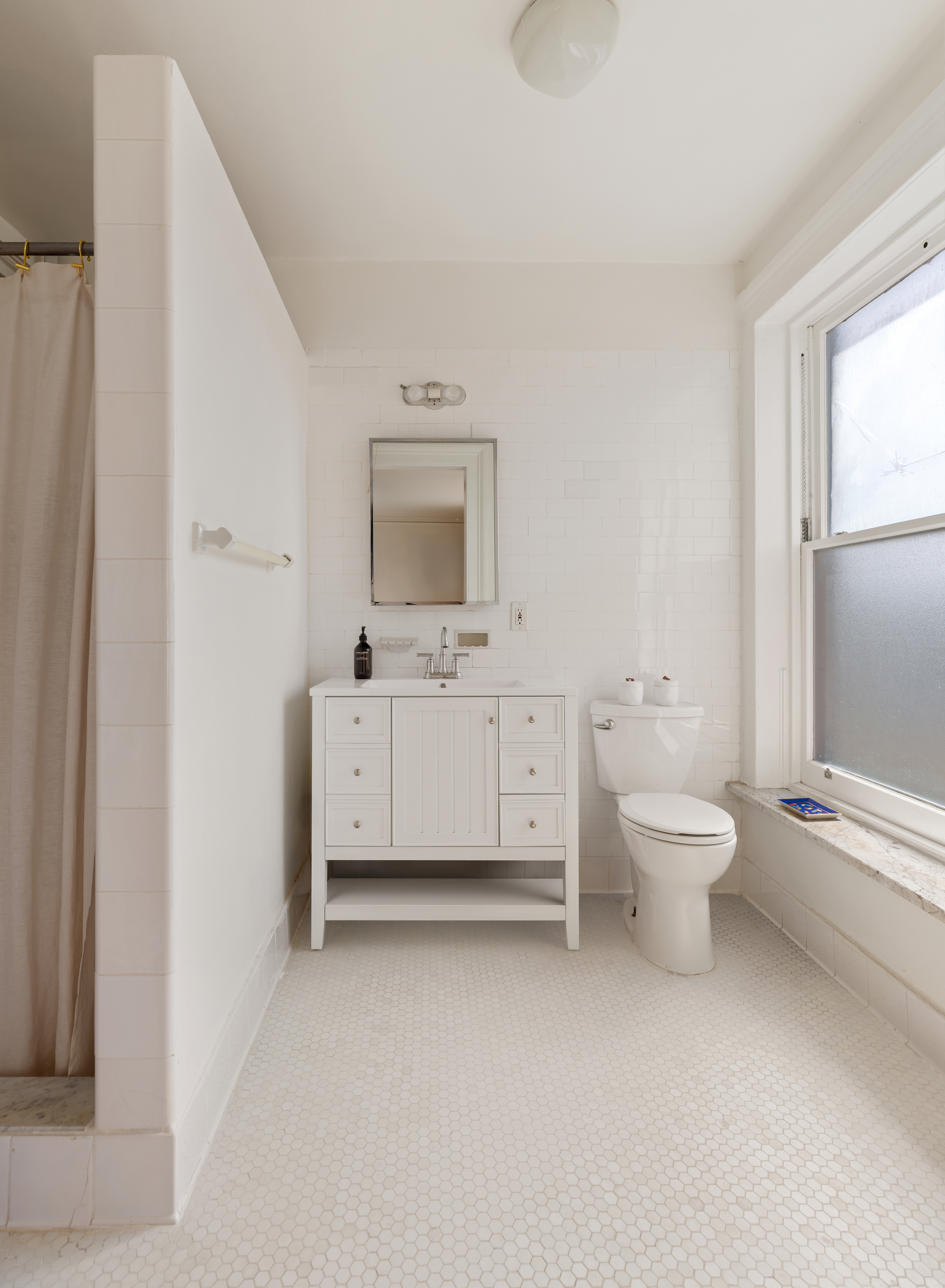 266 Henry Street, Unit B Brooklyn, NY 11201 - Photo 14 of 17 a bathroom with a toilet sink and mirror