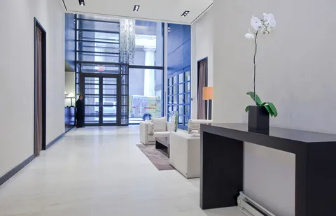 a view of steet corner with a balcony