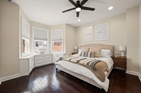a bedroom with a large bed and a window