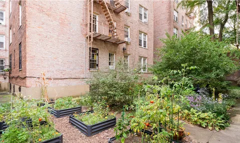 front view of a house with a garden