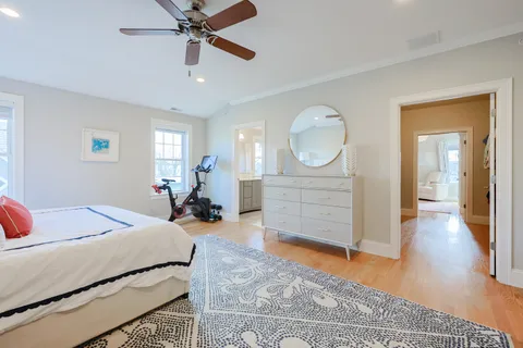 a bedroom with furniture and a chandelier