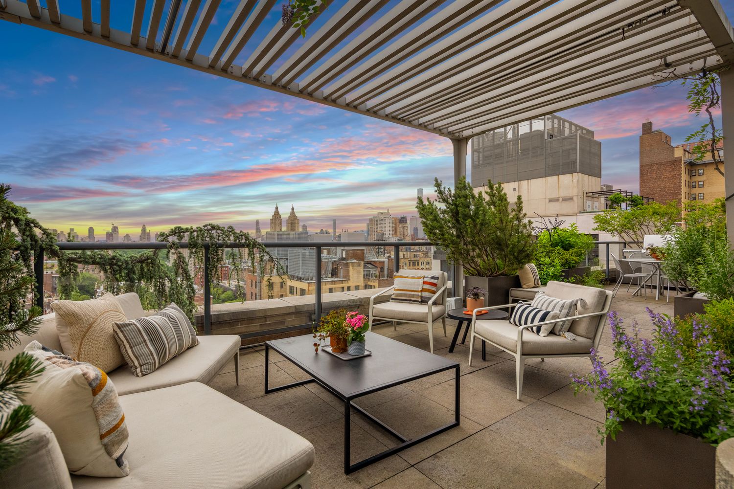 a balcony with furniture and a potted plant