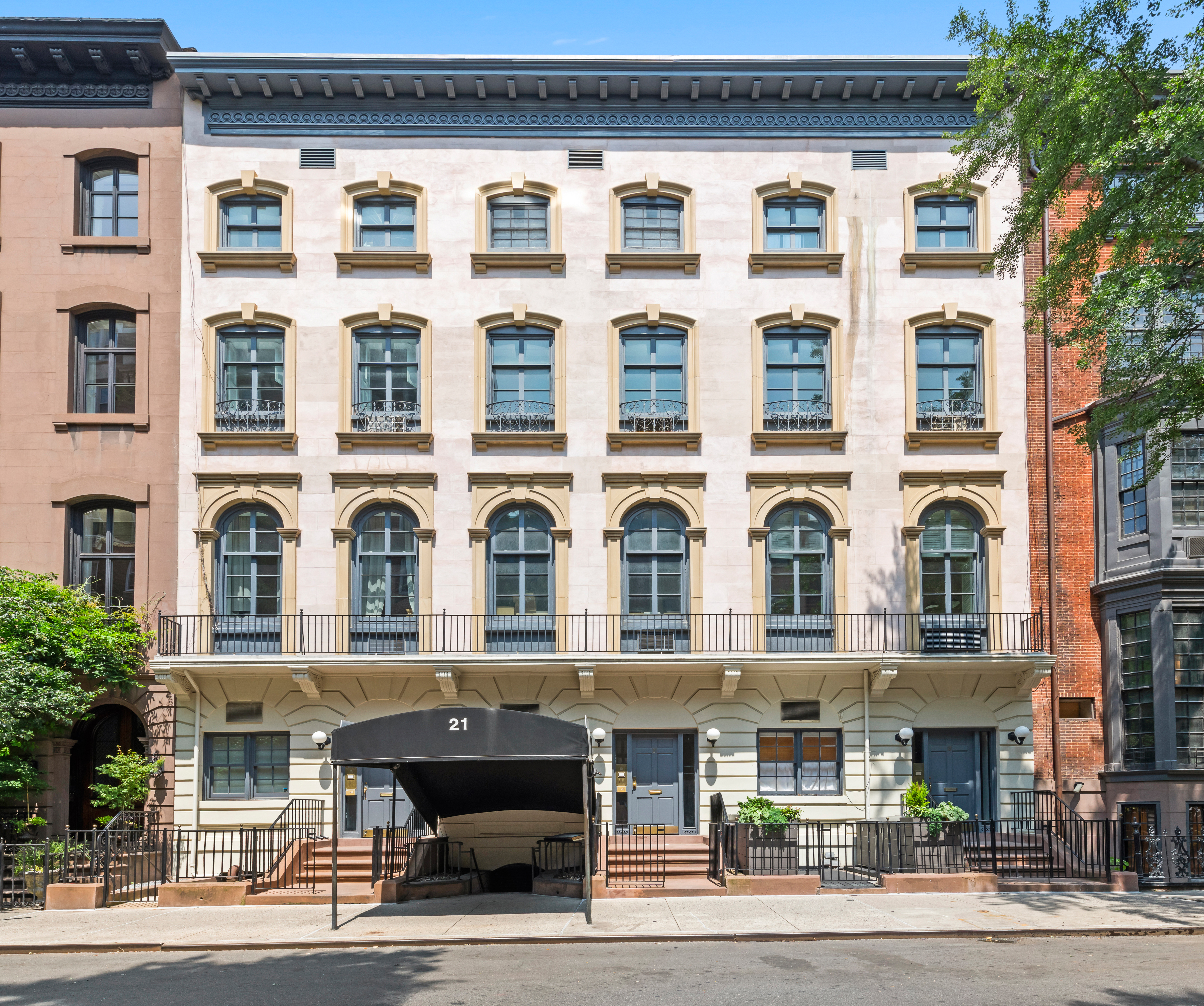 21 West 9th Street, Unit 1F Manhattan, NY 10011 - Photo 9 of 11 a view of a building with a street