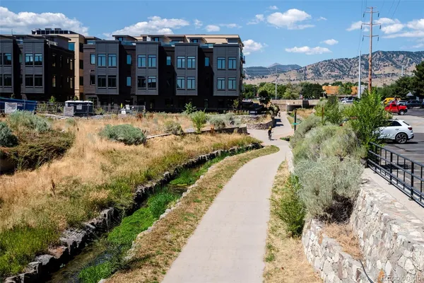 a view of a brick house with a large windows