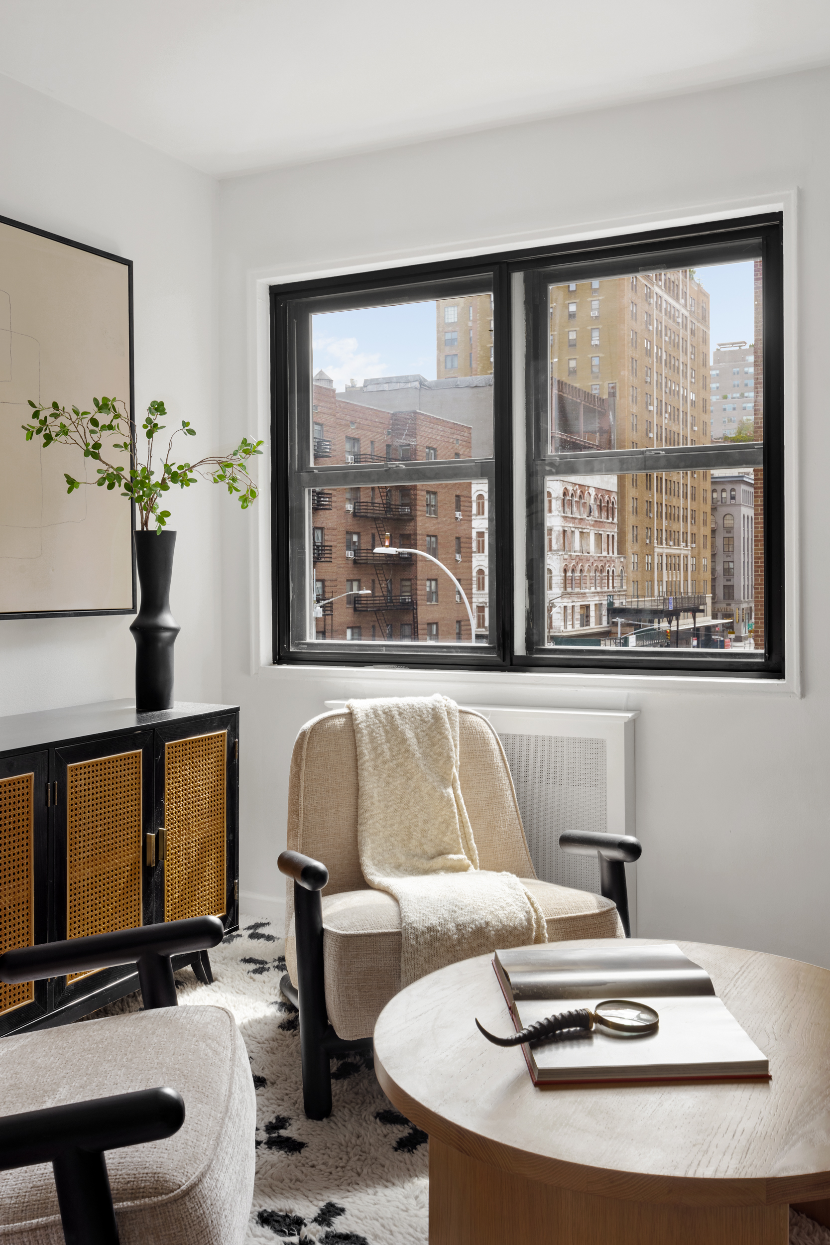 140 7th Avenue, Unit 4L Manhattan, NY 10011 - Photo 5 of 14 a living room with furniture and a large window