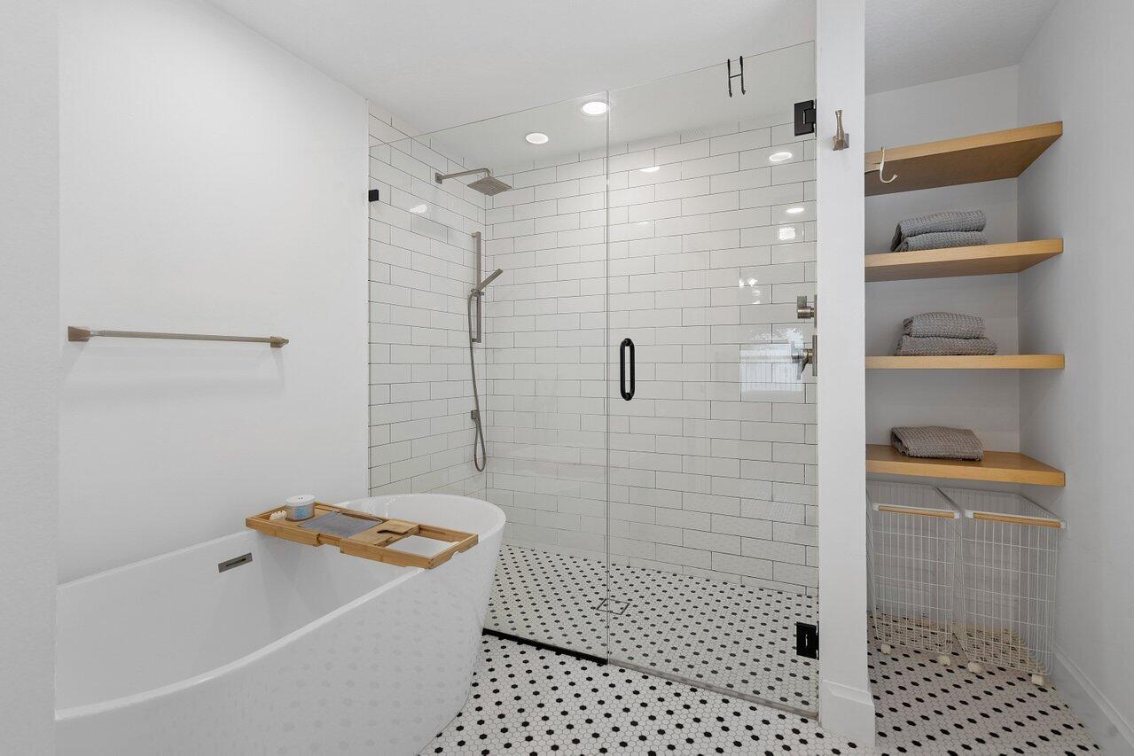 1182 Canoe Point Delray Beach, FL 33444 - Photo 16 of 46 a bathroom with a bathtub and shower