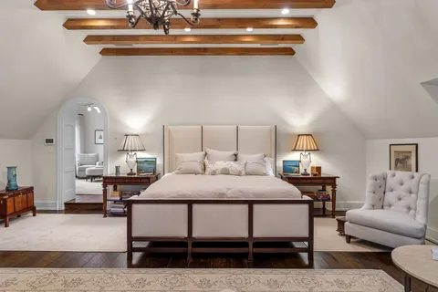 a bathroom with a granite countertop sink mirror and bathtub