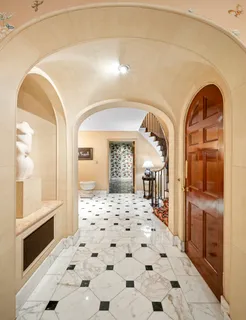 a bathroom with a granite countertop sink a mirror and shower