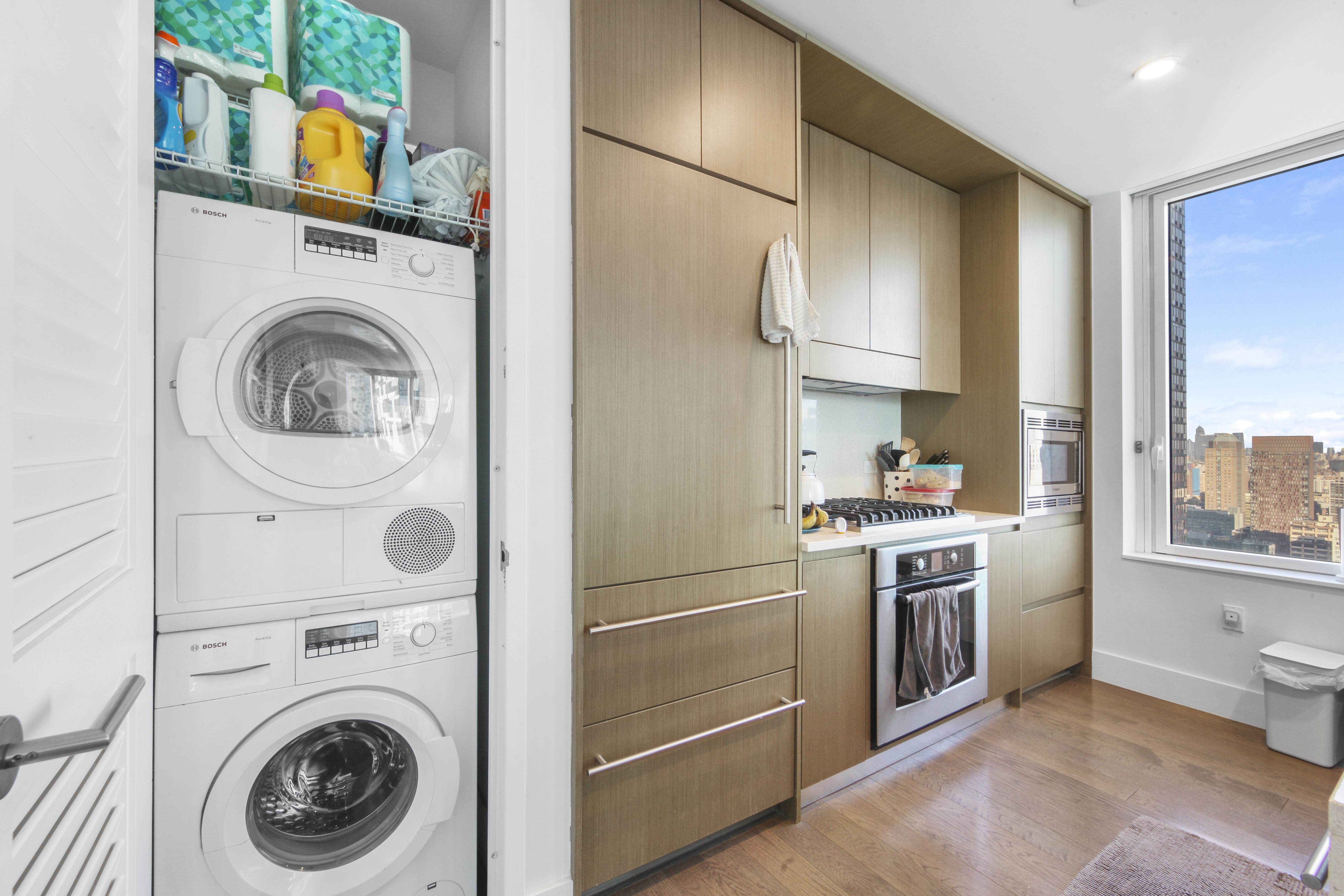 388 Bridge Street, Unit 32G Brooklyn, NY 11201 - Photo 4 of 15 a kitchen with stainless steel appliances granite countertop a refrigerator and a stove