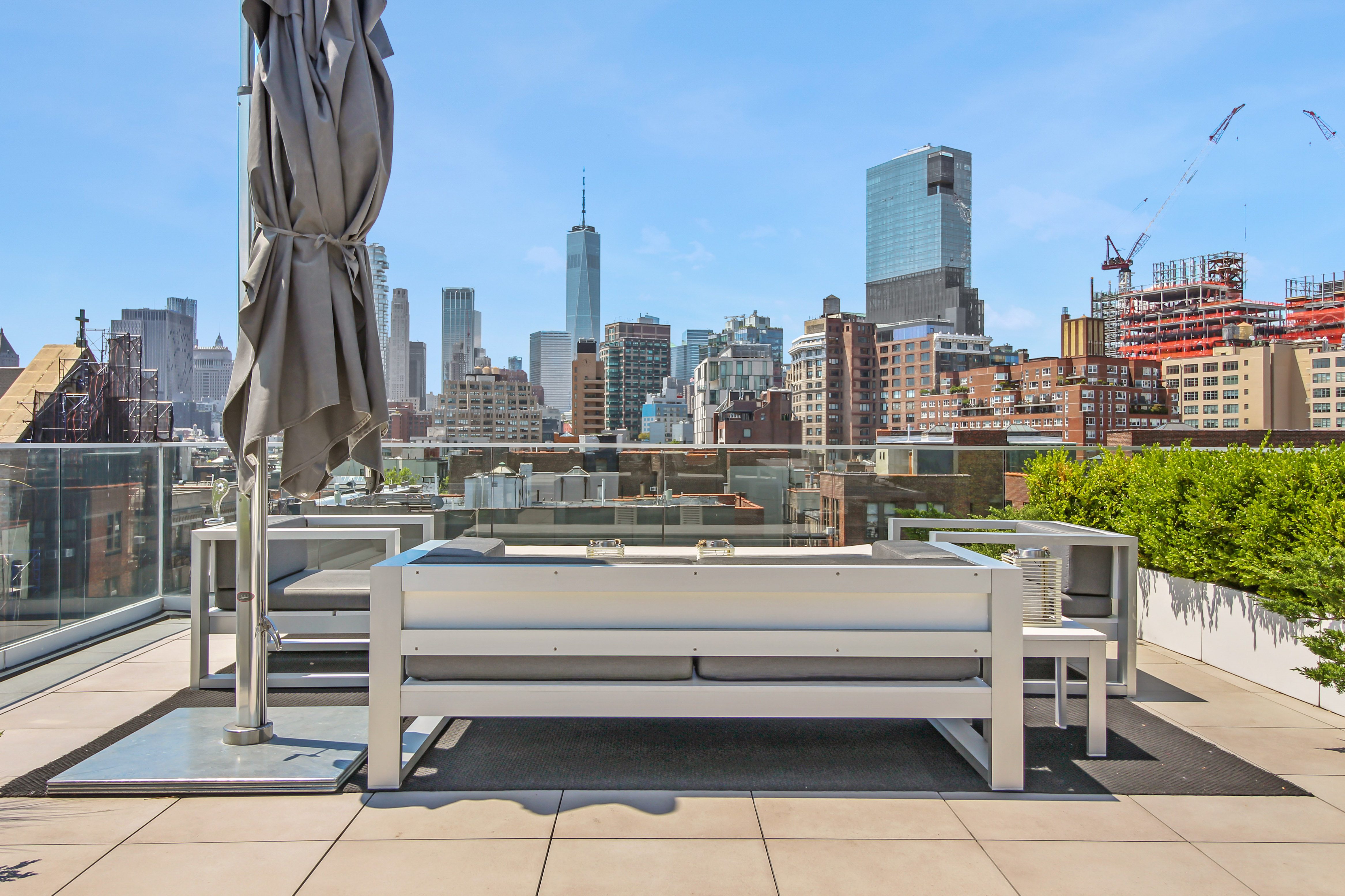 136 West Houston Street, Unit PH Manhattan, NY 10012 - Photo 6 of 26 a view of a city with tall buildings