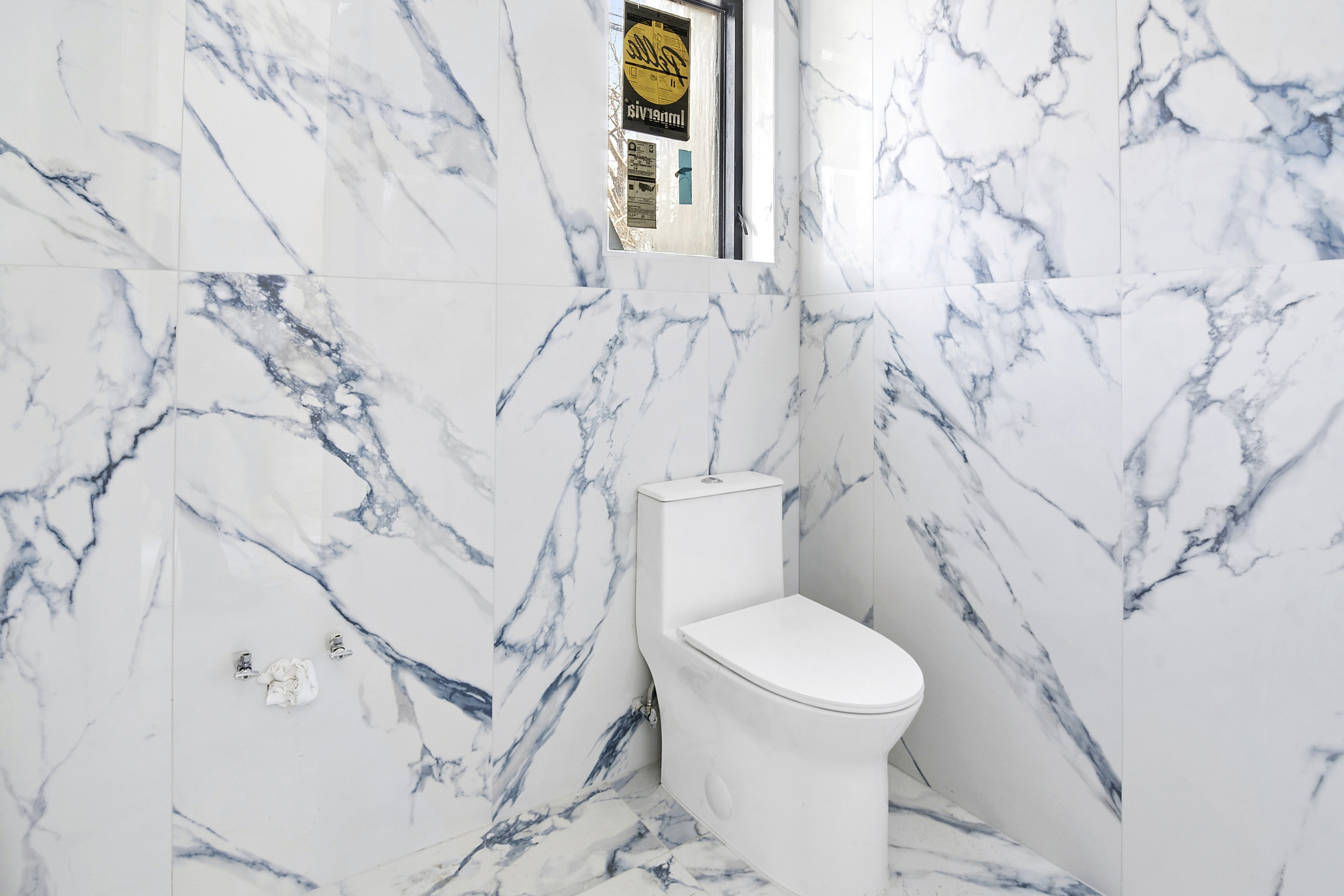3624 Avenue P Brooklyn, NY 11234 - Photo 6 of 26 a white toilet sitting next to a shower curtain