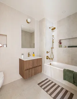 a bathroom with a bathtub and a sink