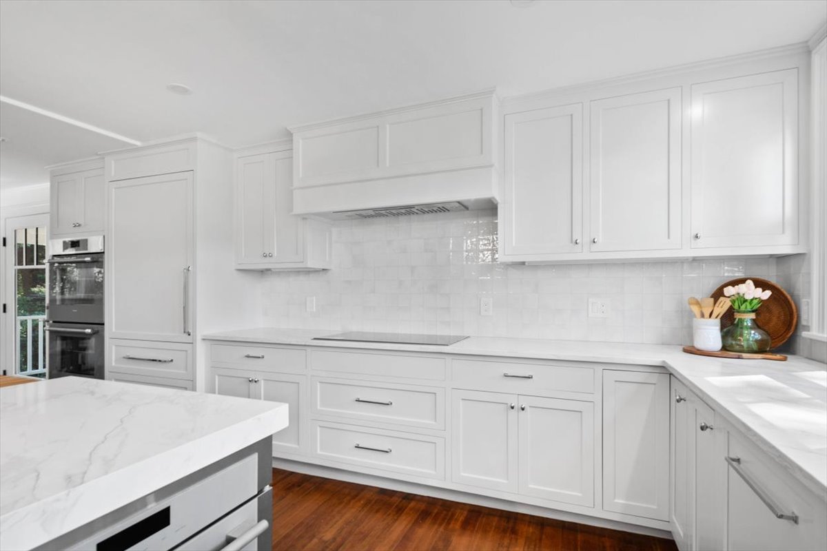49 Garrison Road Hingham, MA 02043 - Photo 4 of 30 a kitchen with white cabinets and appliances