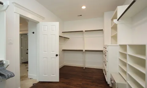 a view of an empty walk in closet