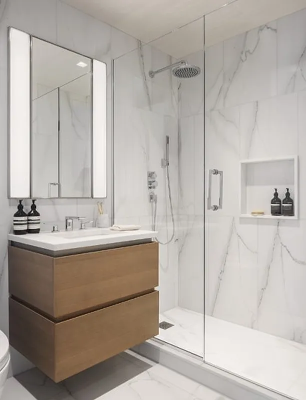 450 Washington Street, Unit 202 Manhattan, NY 10013 - Photo 3 of 14 a bathroom with a bathtub and a shower