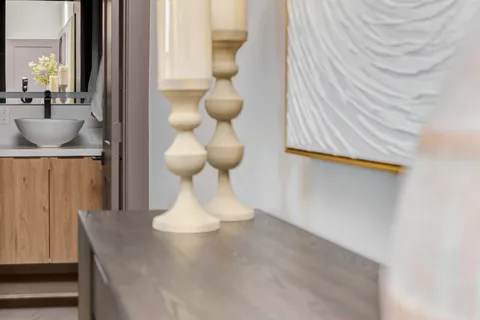 a bathroom with a granite countertop sink toilet and mirror
