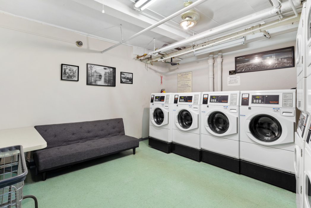 142 East 49th Street, Unit 7B Manhattan, NY 10017 - Photo 10 of 11 a utility room with dryer and washer