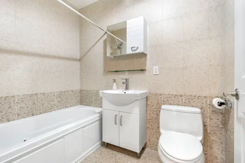 a bathroom with a toilet sink and bathtub