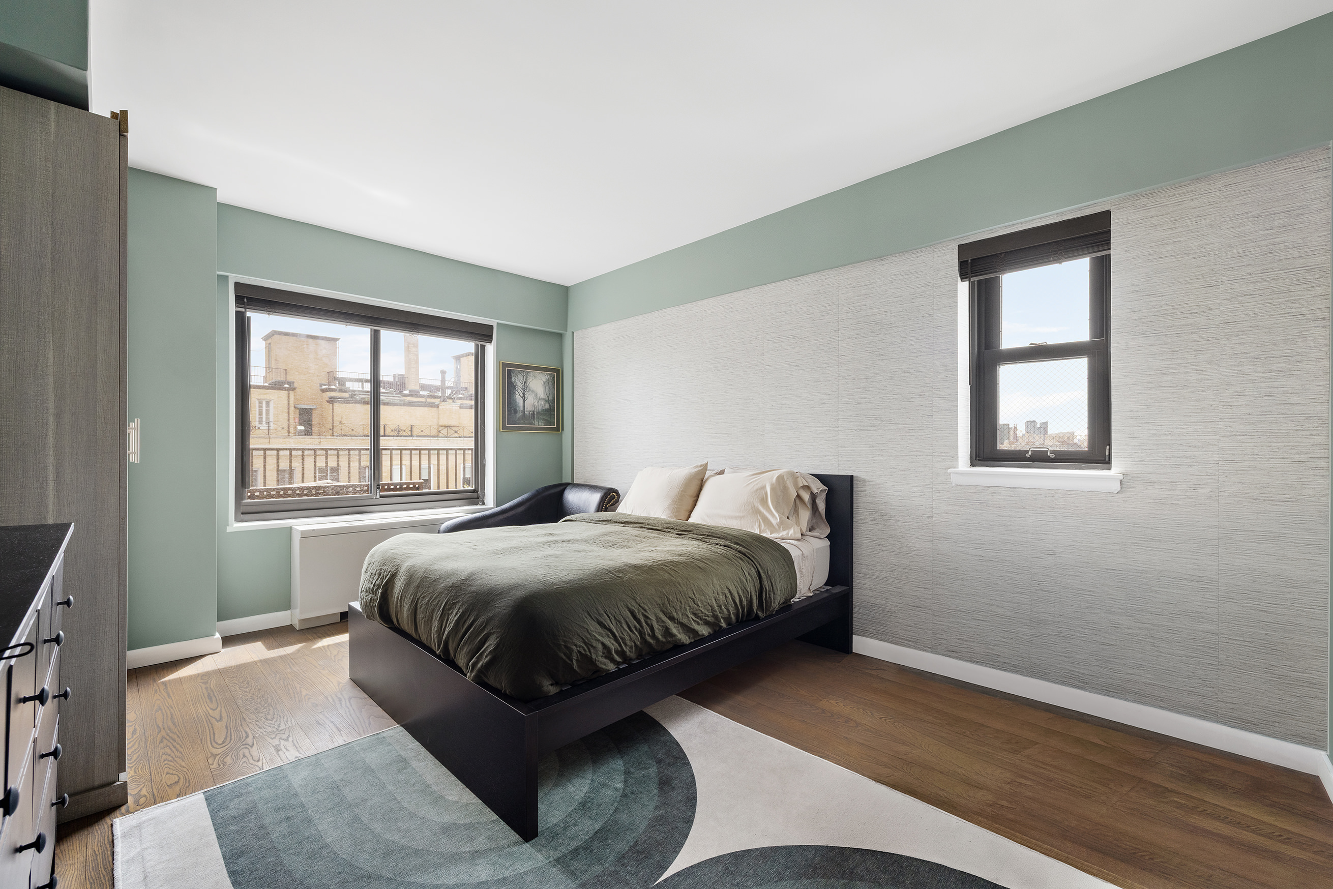 10 East End Avenue, Unit 18D Manhattan, NY 10075 - Photo 9 of 21 a bed sitting in a bedroom next to a window
