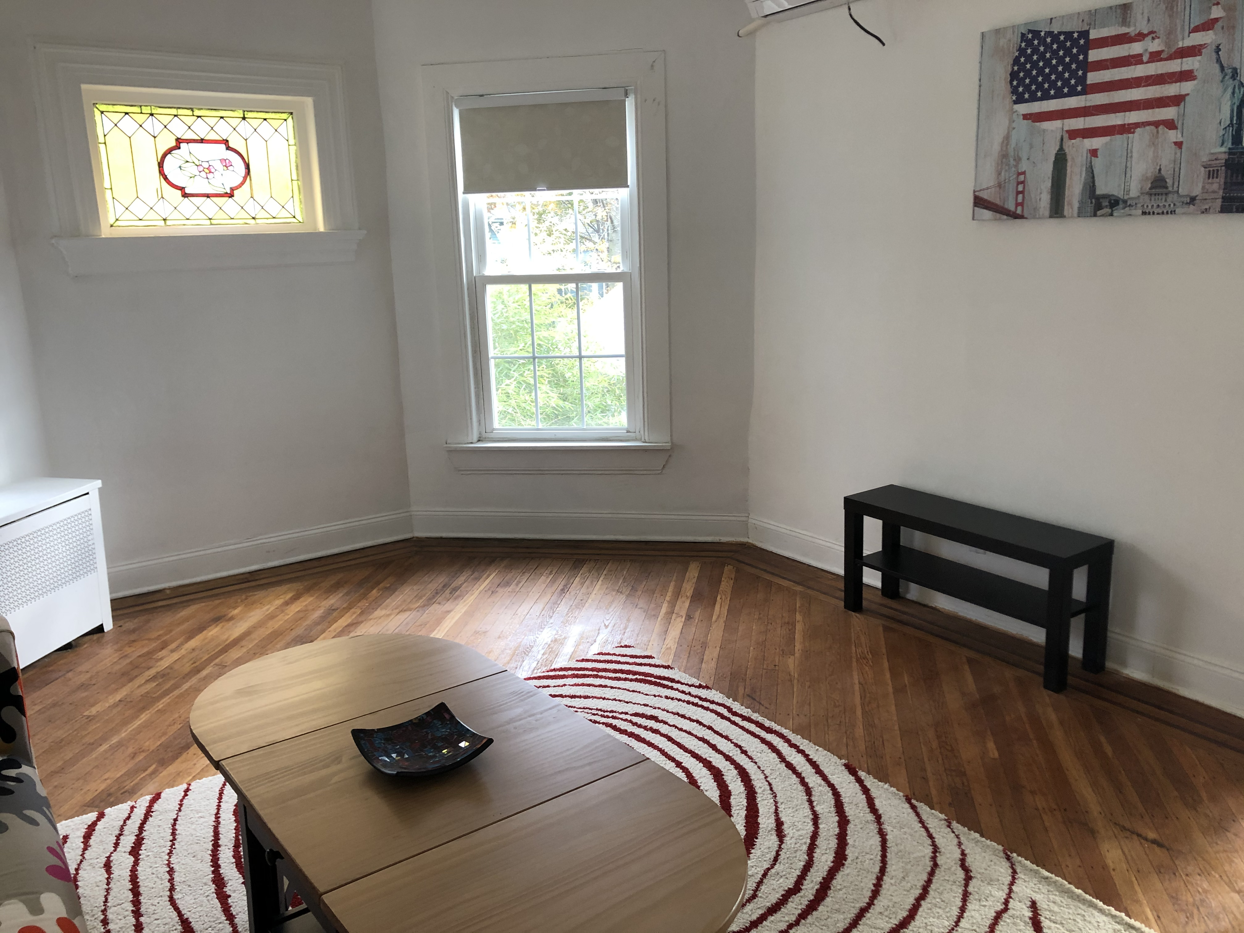 1112 Beverley Road Brooklyn, NY 11218 - Photo 21 of 53 a view of a livingroom with furniture and wooden floor
