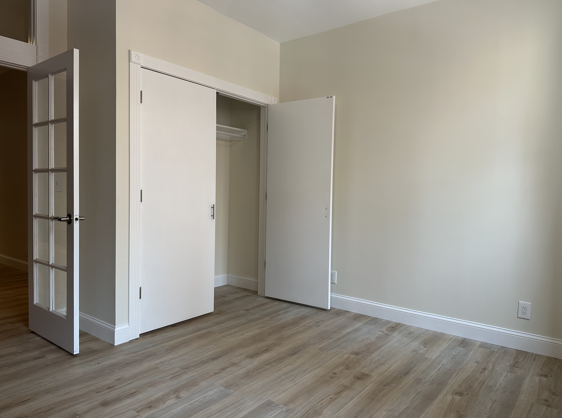 458 West 57th Street, Unit 4FE Manhattan, NY 10019 - Photo 2 of 13 an empty room with wooden floor door