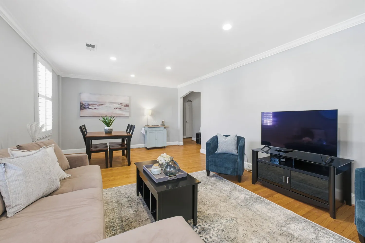 a living room with furniture and a flat screen tv