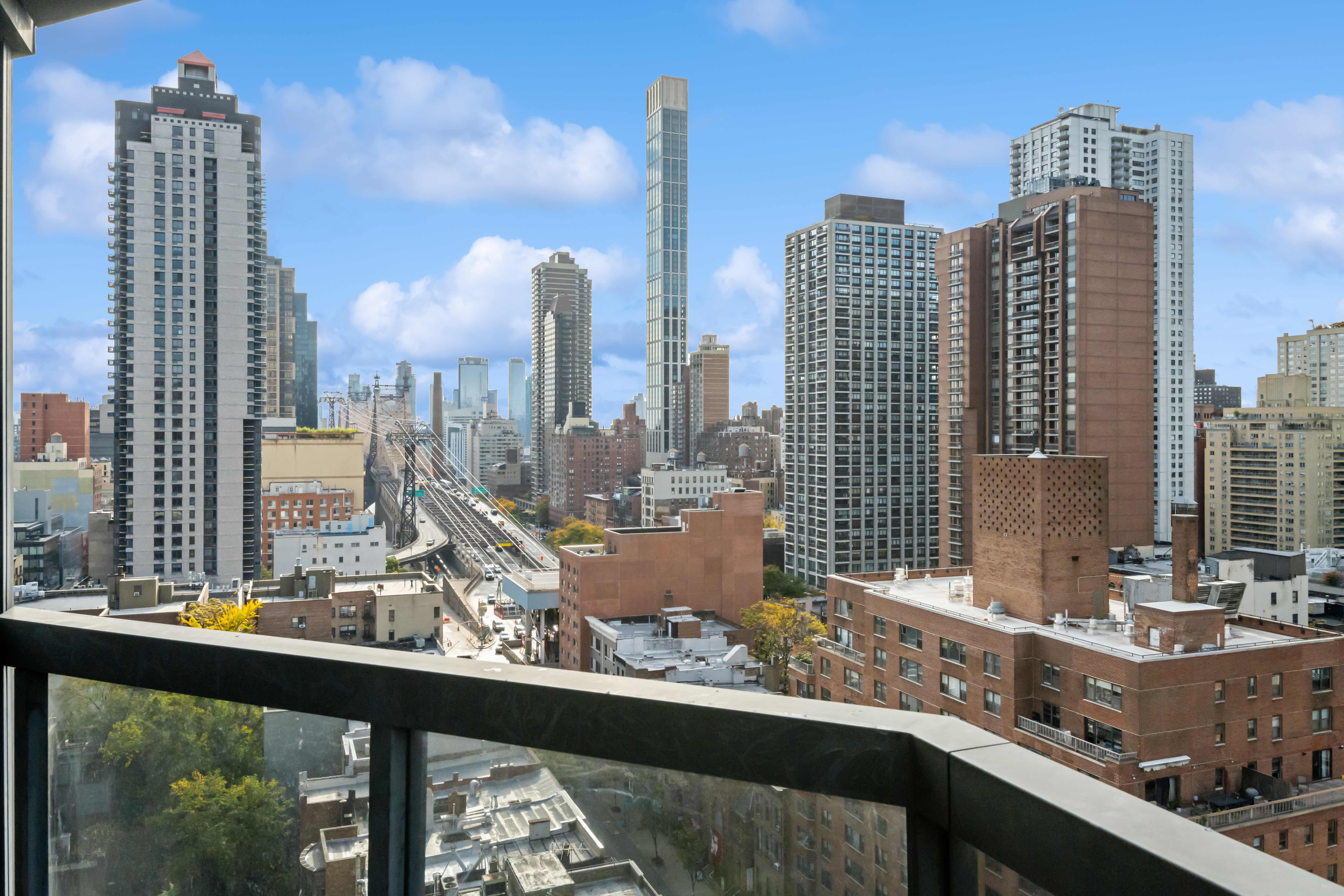 200 East 61st Street, Unit 18A Manhattan, NY 10065 - Photo 7 of 9 a view of a city with tall buildings