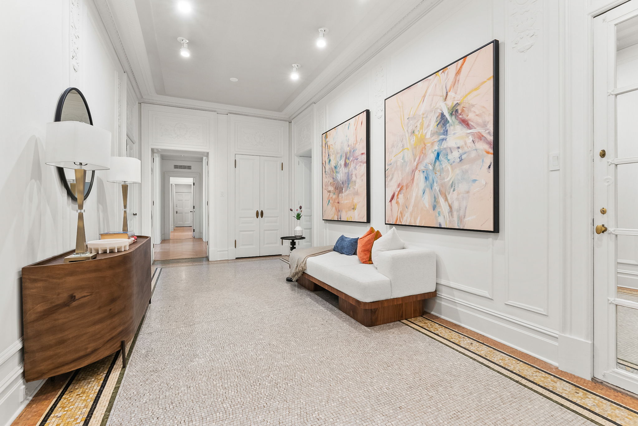 390 West End Avenue, Unit 4J Manhattan, NY 10024 - Photo 13 of 17 a living room with furniture and wall paintings