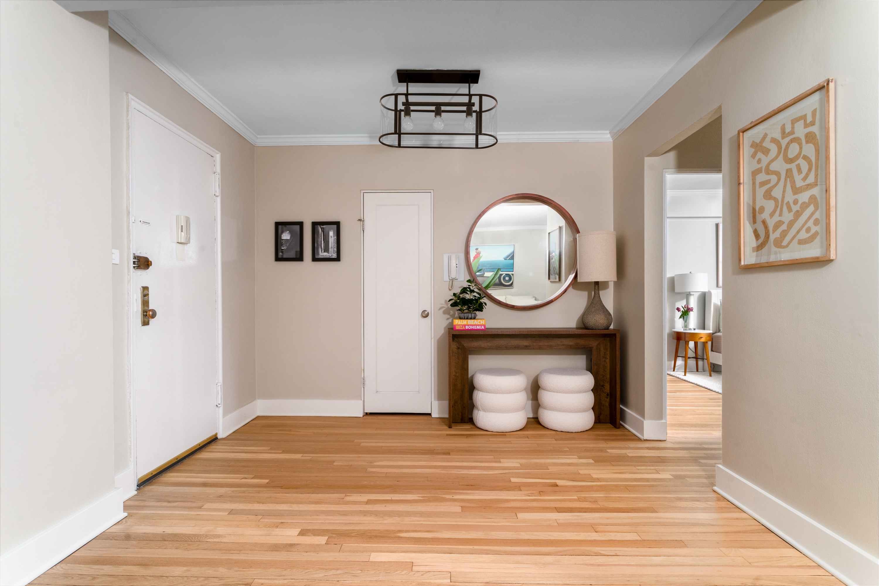60 East 9th Street, Unit 640 Manhattan, NY 10003 - Photo 2 of 10 a view of a hallway with wooden floor and front door