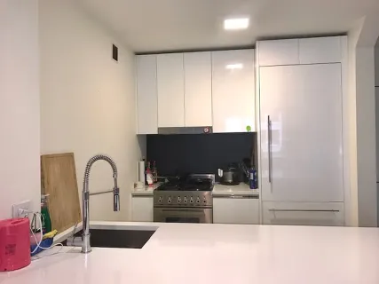 a kitchen with a refrigerator and a sink