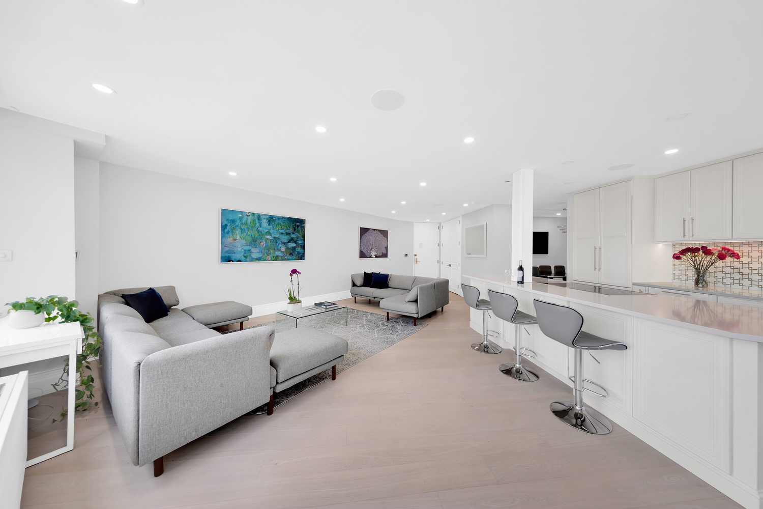 415 East 37th Street, Unit 9JK Manhattan, NY 10016 - Photo 3 of 28 a living room with furniture and white cabinets