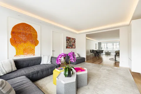 a living room with furniture and a table