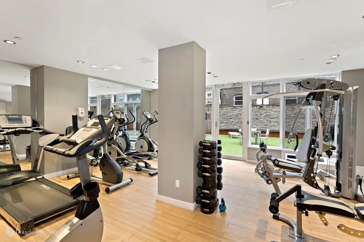 342 East 110th Street, Unit 5E Manhattan, NY 10029 - Photo 13 of 18 a view of a room with gym equipment