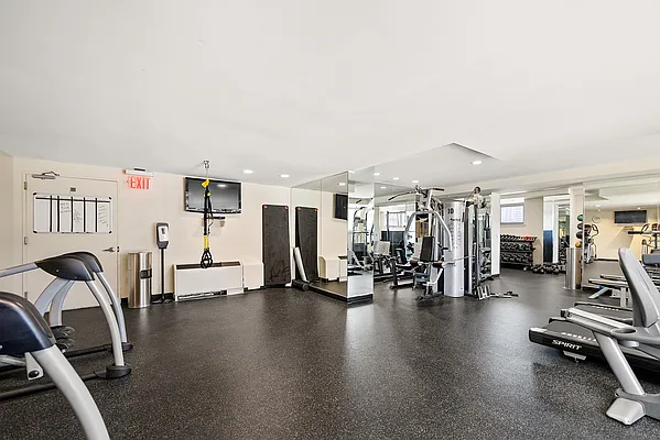 1485 5th Avenue, Unit 13D Manhattan, NY 10035 - Photo 9 of 11 a view of a room with gym equipment