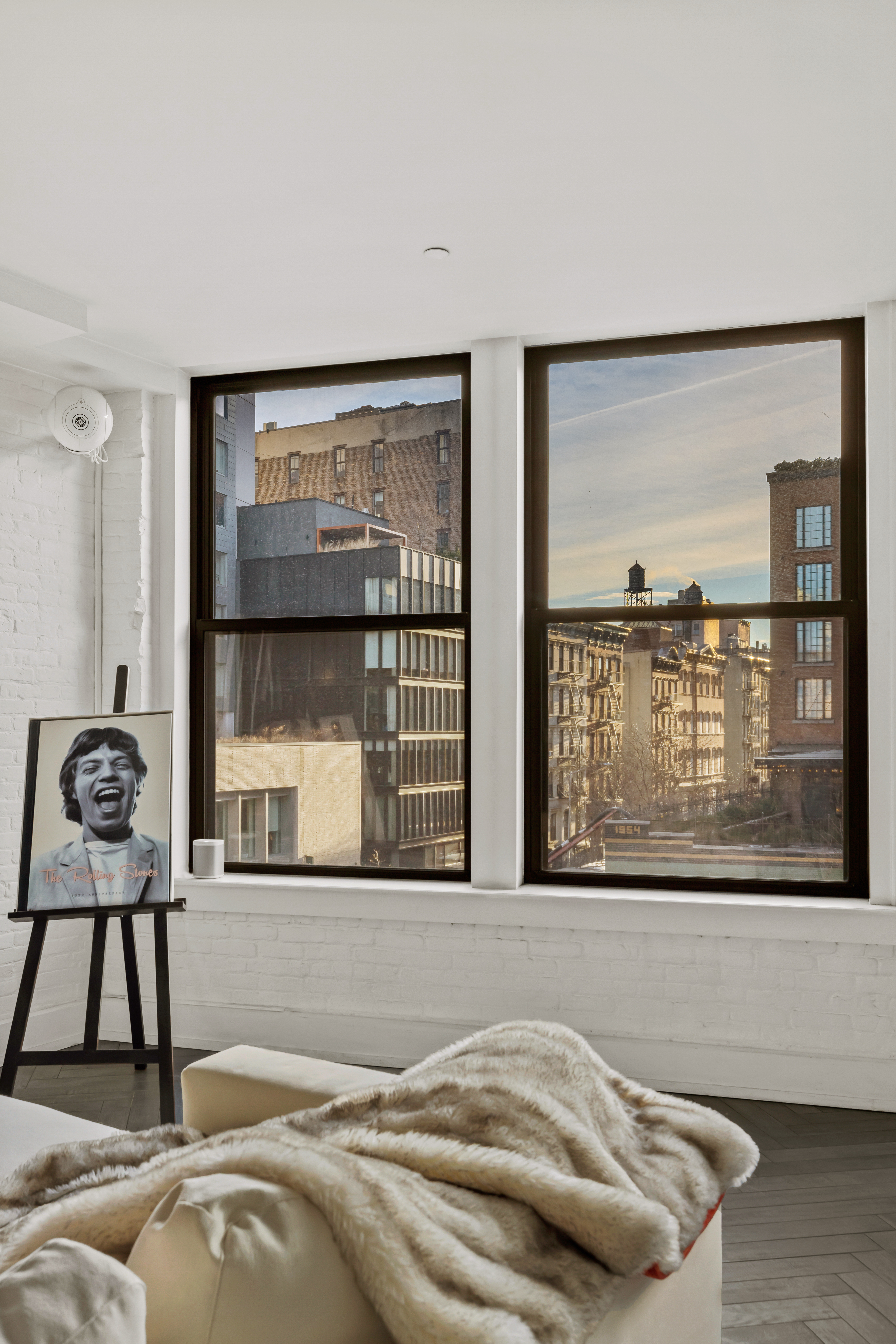 344 Bowery, Unit 3 Manhattan, NY 10012 - Photo 5 of 9 a bedroom with a bed and large window