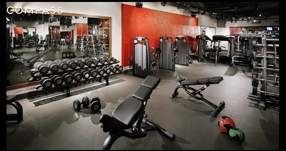 88 Greenwich Street, Unit 1023 Manhattan, NY 10006 - Photo 6 of 20 a view of a room with gym equipment