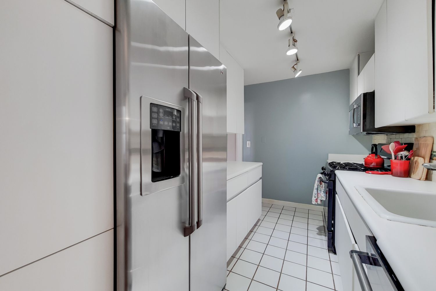 225 East 57th Street, Unit 5K Manhattan, NY 10022 - Photo 8 of 11 a storage room with washer and dryer
