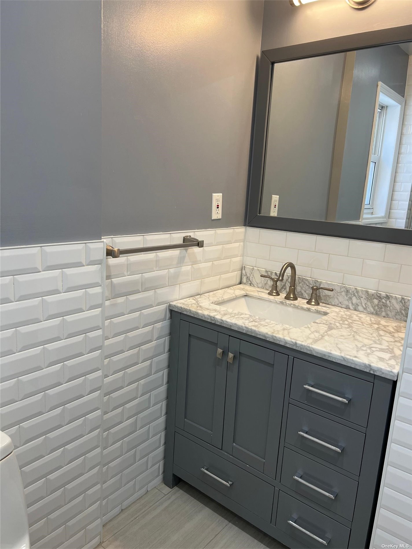 204-11 46th Avenue Queens, NY 11361 - Photo 7 of 7 a bathroom with a sink and a mirror