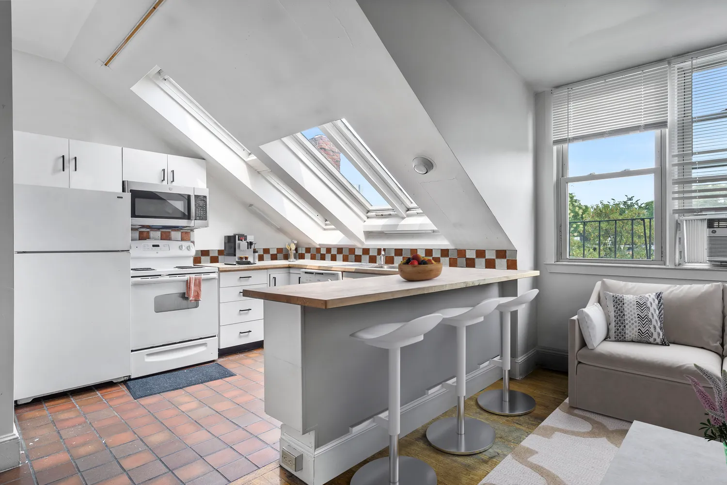 a kitchen with stainless steel appliances granite countertop a sink and a stove